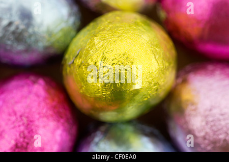 Coloured foil wrapped mini Easter eggs Stock Photo