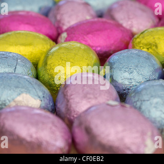 Coloured foil wrapped mini Easter eggs Stock Photo