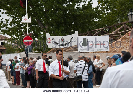 parade of the 'parish' banner in front of the tabuleiros of said parish in this case Santa Maria Dos Olivais - Stock Photo