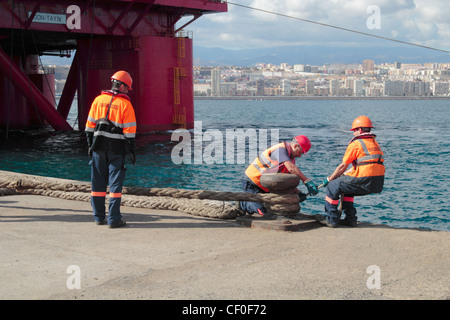 Adjusting mooring ropes on oil rig in Puerto de La Luz, Las Palmas, Gran Canaria, Canary Islands, Spain Stock Photo