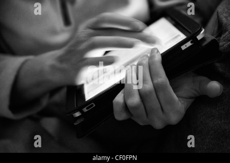 Woman holding Ipad in classic black and white Stock Photo