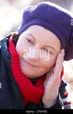 Portrait of an attractive 50 year old woman spending time outdoors. Stock Photo