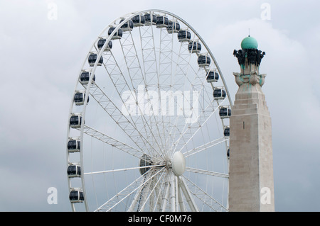 Observation wheel on Plymouth Hoe behind the Naval War Memorial, Plymouth, Devon Uk Stock Photo