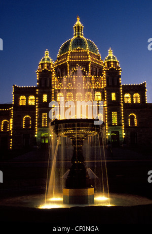 Lights at night illuminate the ornate 1890s Parliament Buildings on Vancouver Island in Victoria, the capital city of British Columbia, Canada. Stock Photo