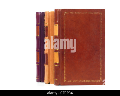 Three volumes of hardcover leather bound book isolated on white background Stock Photo