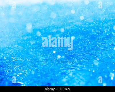 Blue splashing water closeup abstract background texture Stock Photo