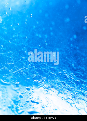 Closeup of splashing water abstract blue background texture
