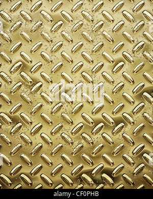 a very large sheet of roughened gold tread or diamond plate Stock Photo