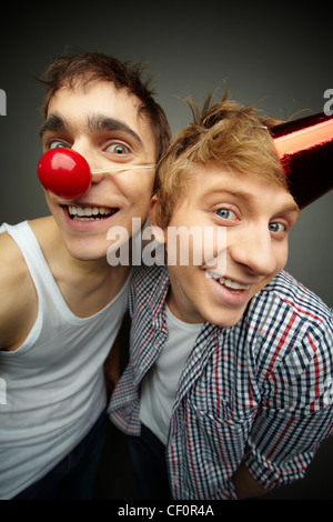 Two guys having fun making faces at camera on fool’s day Stock Photo