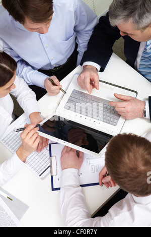 Overview of business people discussing new project Stock Photo