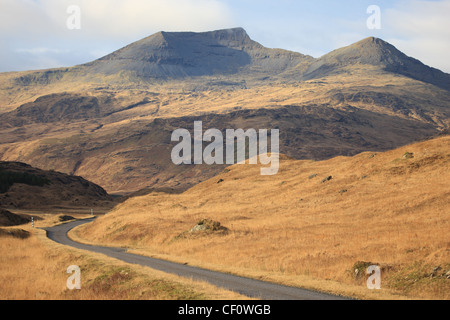 The A849 winding its way through Glen More on the Isle of Mull with Ben More (left) and A'Chioch (right) Stock Photo