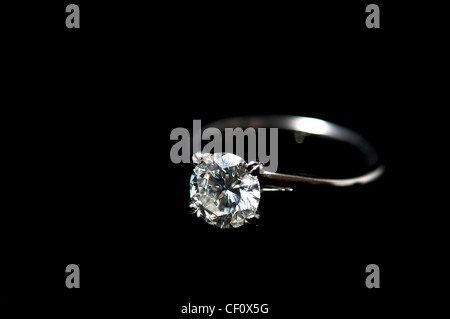 Diamond engagement ring on black Stock Photo