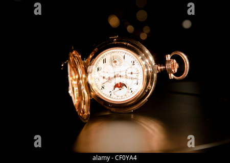 A valuable mechanical pocket watch made of gold. Stock Photo
