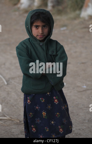 A little girl at the fisherman's village near Fateh Jang, Punjab, Pakistan Stock Photo