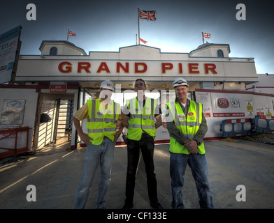 Construction workers putting final touches to the Grand Pier, ruined by fire, at Weston Super Mare , Avon , England UK Stock Photo
