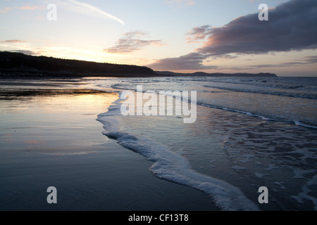 Sunset view of the north Wales coast with the seaside resort of Llandudno and the Great Orme in the background. Stock Photo