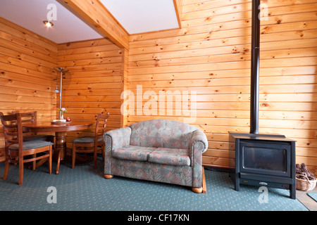 Lodge apartment interior with fireplace. Fox Glacier Lodge, Fox Glacier, West Coast, South Island, New Zealand. Stock Photo