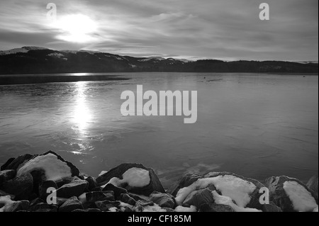 Photograph of Loch Vennacher in the Trossachs in Winter on a very cold day at sunset Stock Photo
