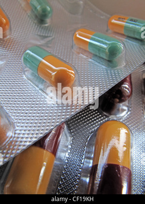 Medication capsules in foil blister packs. Stock Photo