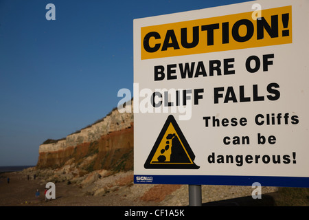 Danger sign warning of unstable cliffs and rock falls in Hunstanton, Norfolk Stock Photo