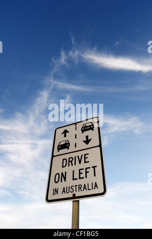 A road sign in Australia that reads 'Drive on left in Australia' Stock Photo