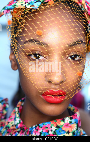 Luella Backstage London Ready to Wear Spring Summer wearing veiled netted hat and bright red lipstick Stock Photo