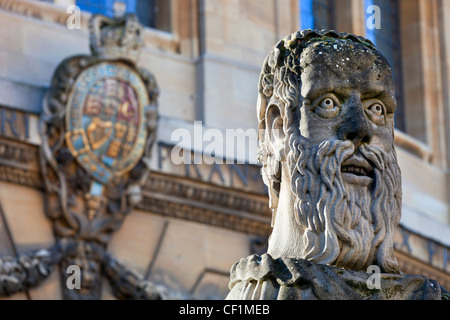 The head of an 'Emperor', one of thirteen busts on top of pillars marking the front boundary of the Sheldonian Theatre, Oxford 2 Stock Photo