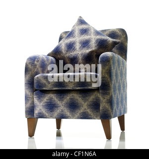 A still life shot of a a stylish blue and white armchair Stock Photo