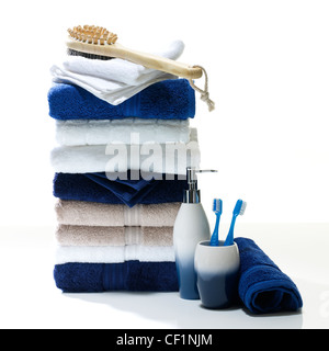 A still life shot of a stack of bathroom towels and accessories Stock Photo
