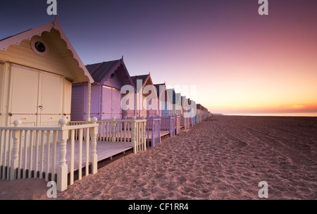 Early dawn over new beach huts on Mersea Island. Stock Photo