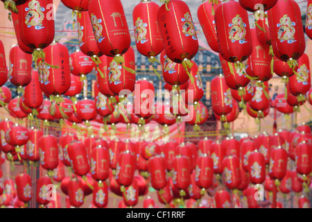Chinese lanterns hanging over a street in London's Chinatown to celebrate Chinese New Year. Stock Photo