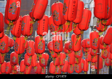 Chinese lanterns hanging over a street in London's Chinatown to celebrate Chinese New Year. Stock Photo