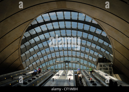 A view from the bottom of the escalators in the cathedral like Canary Wharf tube station towards the entrance. Stock Photo