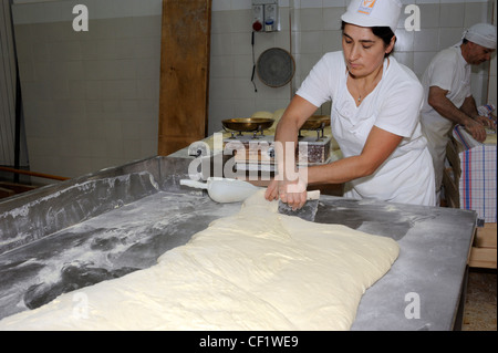 Italy, Basilicata, Roccanova, bakery, baker kneading bread Stock Photo