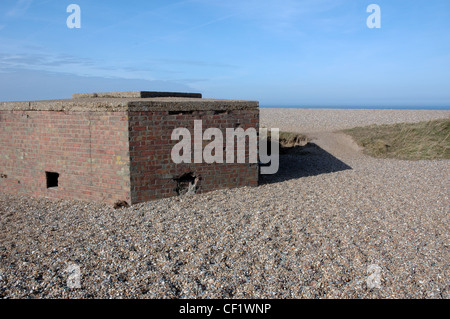 World War Two defence on the shingle beach near Cley next the Sea, Norfolk Coast Path National Trail, UK Stock Photo