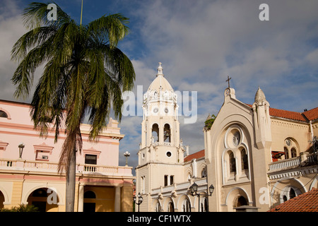 Bell tower of the Iglesia de San Francisco Church and the building of the national theatre in the Old City, Casco Viejo, Panama Stock Photo
