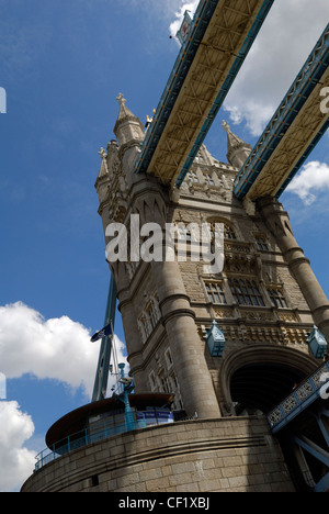 Looking up at one of the towers of Tower Bridge, one of London's most iconic landmarks. Stock Photo