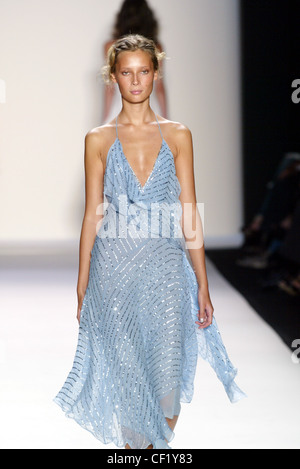 BCBG New York Ready To Wear Spring Summer  Model Tiiu Kuik blonde hair off face wearing pale blue and silver sequinned Stock Photo