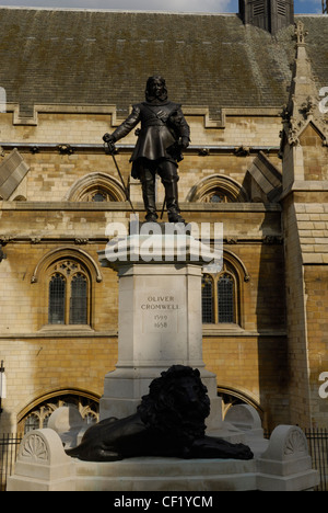 Statue of Oliver Cromwell in front of the Palace of Westminster (Houses of Parliament) in Westminster. Stock Photo