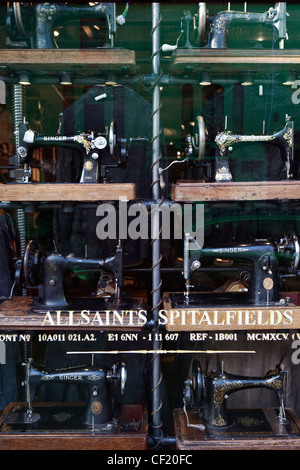 Sewing machines in the window display of All Saint's Spitalfields in Westbourne Grove. Stock Photo