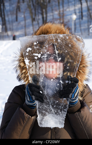 Woman with piece of ice. Stock Photo