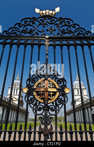 Greenwich Hospital badge on a gate at the Old Royal Naval College on the South bank of the River Thames at Greenwich. Stock Photo