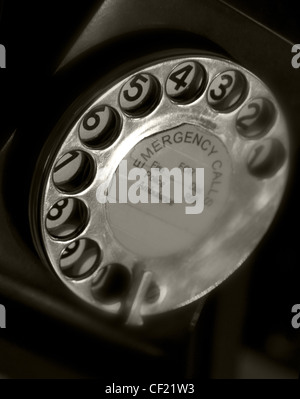 Black Telephone with rotary dial Emergency Call - 999, Scotland, UK Stock Photo