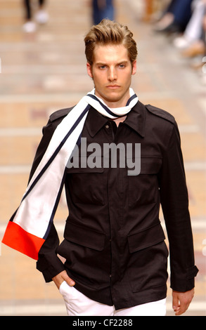 Sonia Rykiel Paris Menswear S S Male model wearing black jacket flap pockets and shoulder epaulettes, accessorized black and Stock Photo