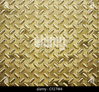 a very large sheet of roughened gold tread or diamond plate Stock Photo