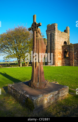 Statue of St. Aidan in the grounds of the Lindisfarne Priory. Stock Photo