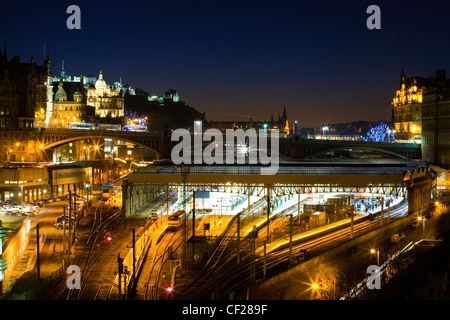 Waverley station, the principal railway station in Edinburgh, situated beneath the North Bridge linking the two towns. Stock Photo