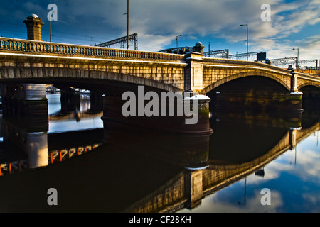 Glasgow Bridge and railway bridge spanning the River Clyde in Glasgow. Stock Photo