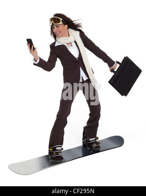 Attractive woman wearing business suit, carrying briefcase and cell phone, riding a snowboard on white background. Stock Photo