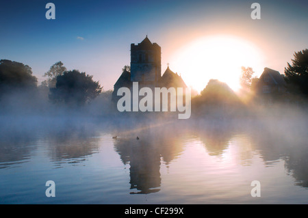 Bisham Church in the early morning mist with ducks. Bisham is home to one of the Sport England's National Sports Centres, centre Stock Photo